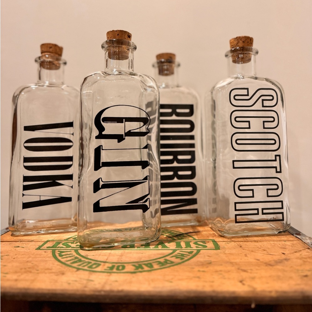 Vintage set of 4 TCW liquor decanter bottles